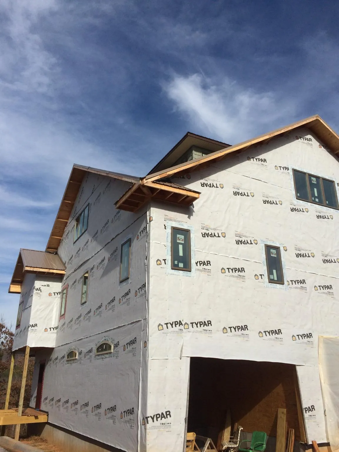 Stick built house wrapped in Typar with new roof framing and dormers in Moclips